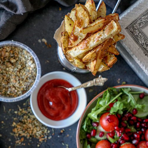 Rosemary spiced Potato wedges served with ketchup and salad