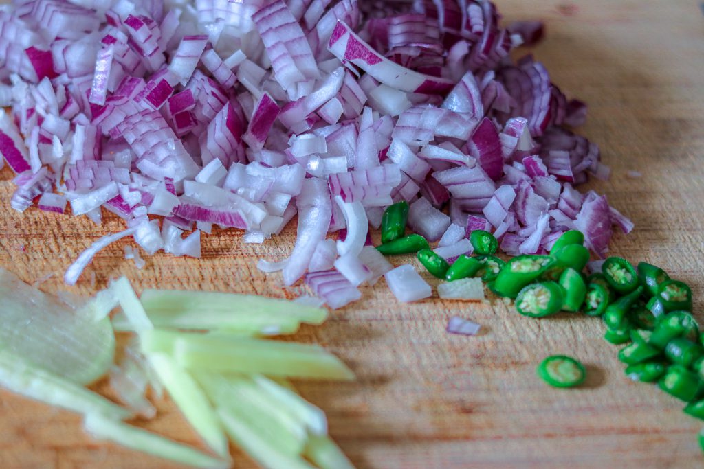 Chopped onions, ginger and chilli for tadka