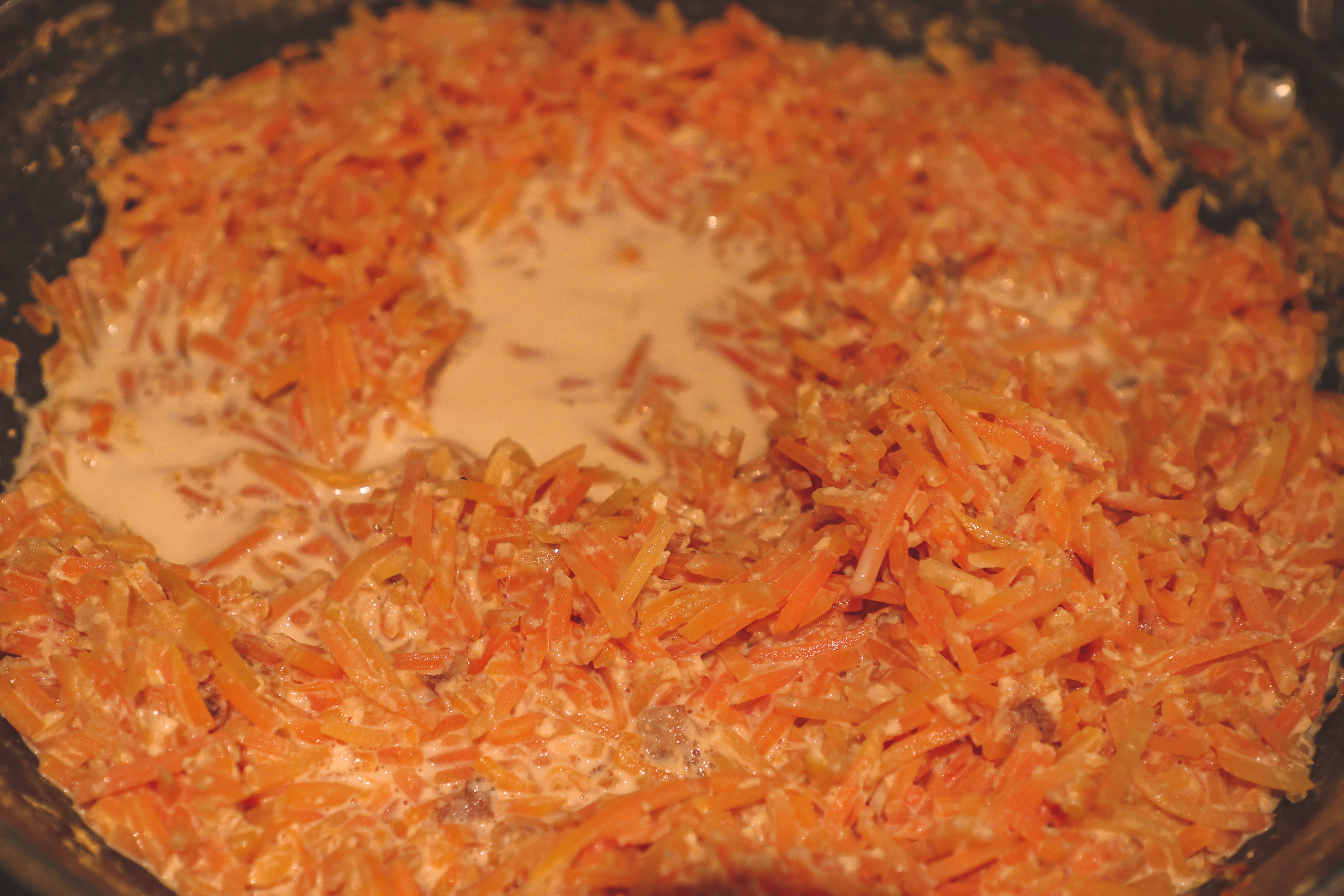 Grated Carrots simmering in milk
