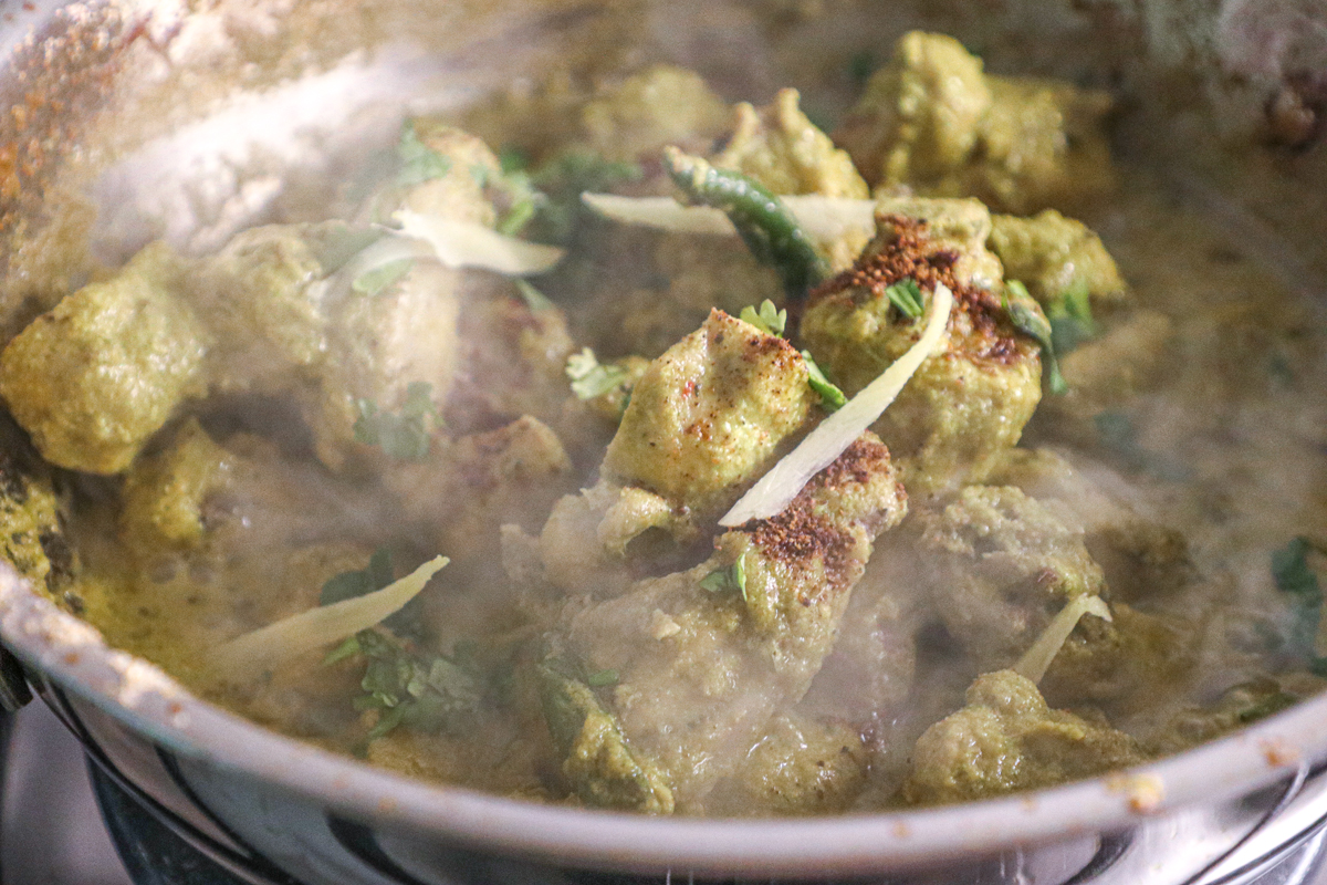 green chilli chicken being cooked in a karahi