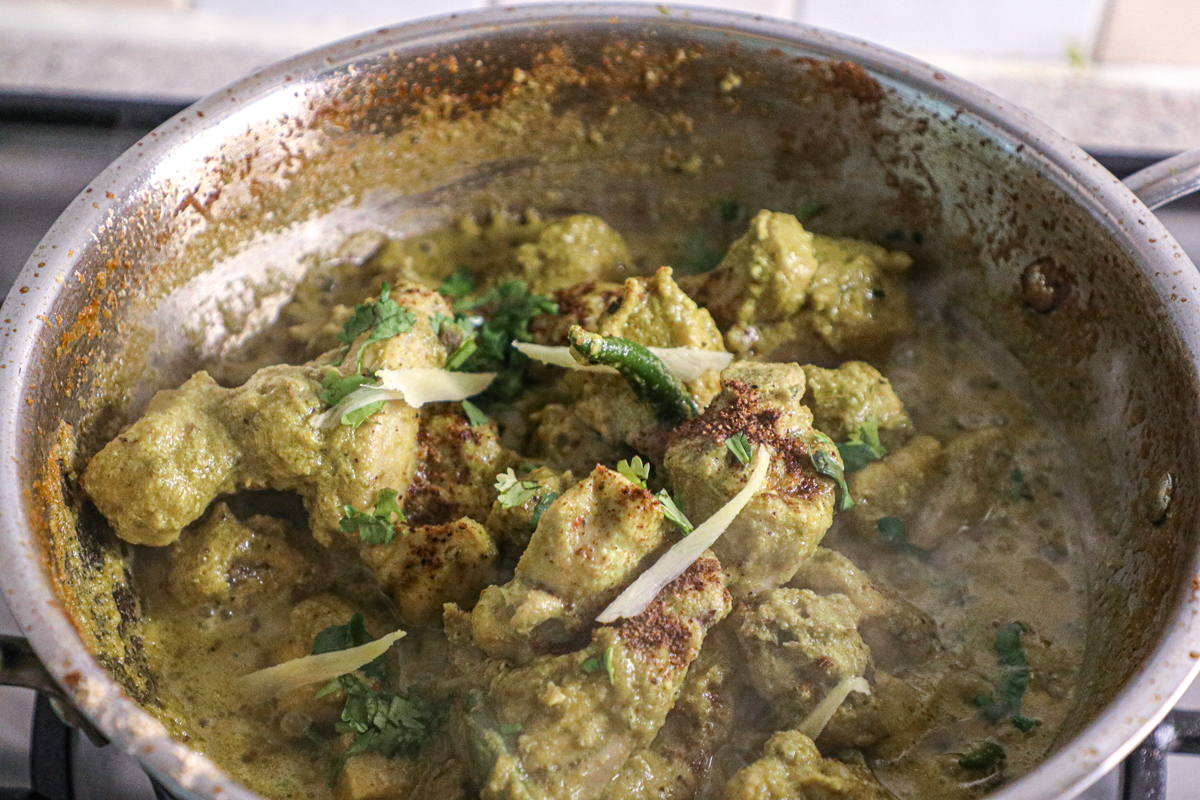 green chilli chicken being cooked in a karahi